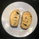 Pawpaw fruit split open on plate to show interior